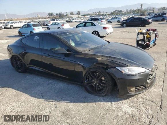 2014 Tesla Model S 60 с VIN 5YJSA1H16EFP40654, выставлен на аукционе Copart как лот 72070974 с пробегом Не указан миль и Списание • Salvage title. История ставок и продаж доступна на DreamBid. Изображение 4.