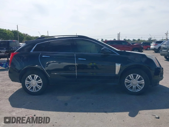 2015 Cadillac SRX with VIN 3GYFNAE33FS522380, listed as a IAAI auction lot 41641899 with 193,818 mi miles and . Bid and sale history available at DreamBid. Image 14.