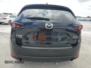2021 Mazda CX-5 Touring z VIN JM3KFBCM8M1436782, wystawiony jako Copart lot #54144645 z przebiegiem 52 388 mil mil oraz Szkoda całkowita • Salvage title. Historia ofert i sprzedaży dostępna na DreamBid. Obrazek 6.