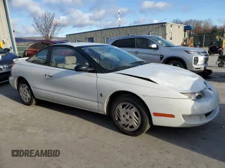 1999 Saturn SC with VIN 1G8ZR1275XZ375833, listed as a Copart auction lot 87960885 with 97,697 mi miles and Salvage Title. Bid and sale history available at carsss.com. Image 4.