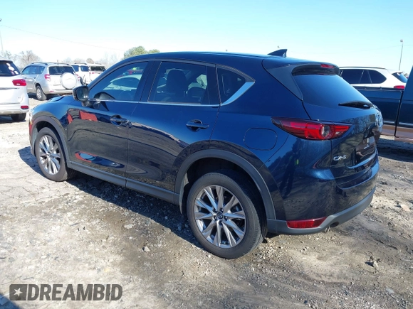 2021 Mazda CX-5 Grand Touring with VIN JM3KFADM5M0428279, listed as a IAAI auction lot 41747175 with 49,579 mi miles. Bid and sale history available at carsss.com. Image 3.