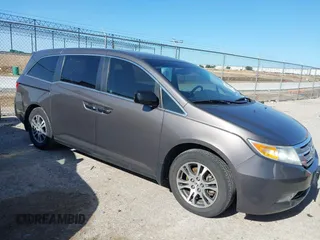2012 Honda Odyssey EX-L with VIN 5FNRL5H62CB033799, listed as a IAAI auction lot 42303434 with 171,057 mi miles and . Bid and sale history available at DreamBid. Image 1.