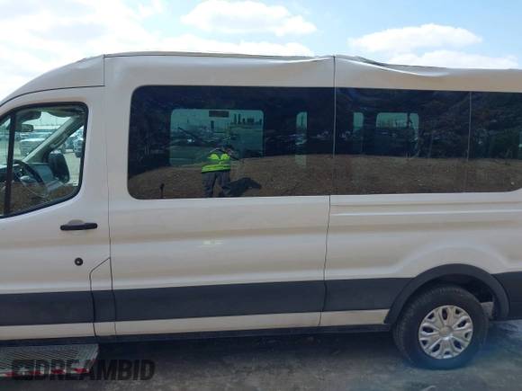 2021 Ford Transit Cargo with VIN 1FTBR1C85MKA66513, listed as a IAAI auction lot 42016528 with 18,174 mi miles and . Bid and sale history available at DreamBid. Image 14.