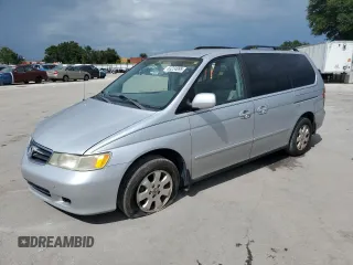 2002 Honda Odyssey EX with VIN 5FNRL186X2B005109, listed as a Copart auction lot 63224095 with 177,823 mi miles and Salvage title. Bid and sale history available at DreamBid. Image 1.