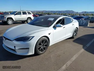 2022 Tesla Model S Plaid with VIN 5YJSA1E64NF479959, listed as a IAAI auction lot 41057673 with 27,203 mi miles. Bid and sale history available at carsss.com. Image 6.