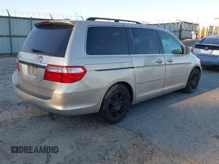 2006 Honda Odyssey Touring z VIN 5FNRL38856B098897, wystawiony jako IAAI lot #41251740 z przebiegiem 258 408 mil mil oraz . Historia ofert i sprzedaży dostępna na DreamBid. Obrazek 4.