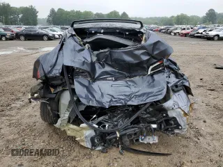 2023 Tesla Model Y Long Range z VIN 7SAYGDEE7PF870370, wystawiony jako Copart lot #55700135 z przebiegiem 32 410 mil mil oraz Szkoda całkowita • Salvage title. Historia ofert i sprzedaży dostępna na DreamBid. Obrazek 6.