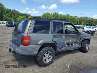 1997 Jeep Grand Cherokee Laredo with VIN 1J4GZ58S7VC505069, listed as a Copart auction lot 63255945 with 127,552 mi miles and Salvage title. Bid and sale history available at DreamBid. Image 3.