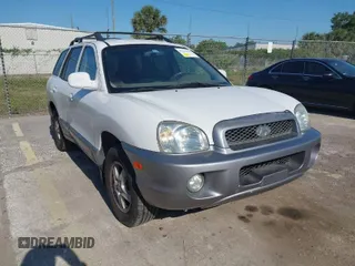 2004 Hyundai Santa Fe GLS with VIN KM8SC73D74U675555, listed as a IAAI auction lot 42021978 with 198,778 mi miles. Bid and sale history available at carsss.com. Image 1.