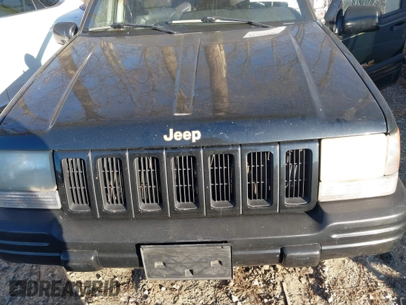 1997 Jeep Grand Cherokee Limited with VIN 1J4GZ78Y7VC688375, listed as a IAAI auction lot 41255946 with 216,544 mi miles. Bid and sale history available at carsss.com. Image 6.