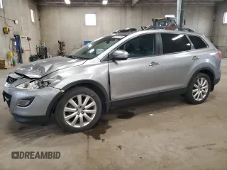 2010 Mazda CX-9 Grand Touring with VIN JM3TB3MVXA0235593, listed as a Copart auction lot 60171135 with 128,173 mi miles and Salvage title. Bid and sale history available at DreamBid. Image 1.