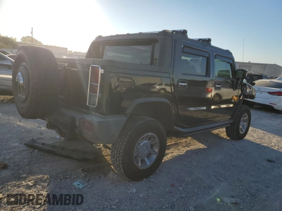 2005 Hummer H2 SUT z VIN 5GRGN22U85H109003, wystawiony jako Copart lot #76557734 z przebiegiem 115 249 mil mil oraz Szkoda całkowita • Salvage title. Historia ofert i sprzedaży dostępna na DreamBid. Obrazek 3.