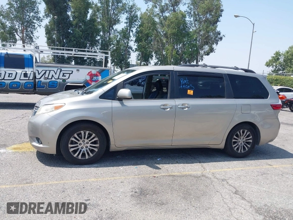 2015 Toyota Sienna XLE with VIN 5TDYK3DC4FS560743, listed as a IAAI auction lot 42488745 with 145,009 mi miles and . Bid and sale history available at DreamBid. Image 14.
