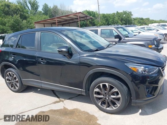 2016 Mazda CX-5 Grand Touring z VIN JM3KE2DY2G0765444, wystawiony jako IAAI lot #42527577 z przebiegiem 162 871 mil mil oraz . Historia ofert i sprzedaży dostępna na DreamBid. Obrazek 13.