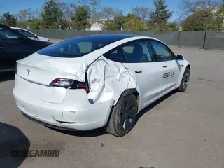 2022 Tesla Model 3 with VIN 5YJ3E1EA2NF245817, listed as a IAAI auction lot 41976493 with 32,710 mi miles and . Bid and sale history available at DreamBid. Image 4.