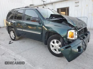 2005 GMC Envoy SLT with VIN 1GKDS13S652329610, listed as a Copart auction lot 76384914 with Not Provided miles and Salvage Title. Bid and sale history available at DreamBid. Image 4.