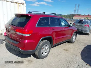 2014 Jeep Grand Cherokee Laredo with VIN 1C4RJFAG8EC262292, listed as a IAAI auction lot 40568162 with 124,871 mi miles and . Bid and sale history available at DreamBid. Image 4.