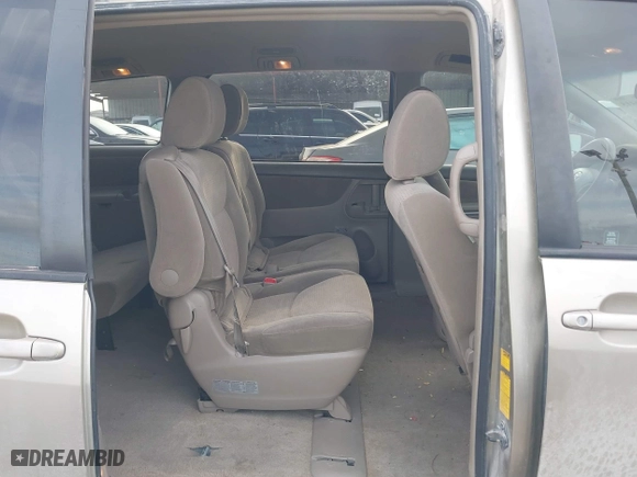 2010 Toyota Sienna CE with VIN 5TDKK4CC9AS311702, listed as a IAAI auction lot 41586415 with 206,453 mi miles. Bid and sale history available at carsss.com. Image 8.