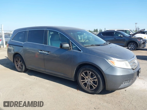 2012 Honda Odyssey EX-L with VIN 5FNRL5H6XCB061026, listed as a IAAI auction lot 42574612 with 144,480 mi miles and . Bid and sale history available at DreamBid. Image 13.
