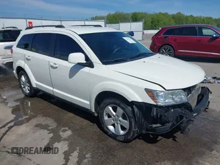 2012 Dodge Journey SXT z VIN 3C4PDDBG8CT293223, wystawiony jako IAAI lot #42096310 z przebiegiem 156 926 mil mil oraz . Historia ofert i sprzedaży dostępna na DreamBid. Obrazek 1.