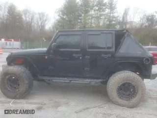 2013 Jeep Wrangler Unlimited Sport with VIN 1C4BJWDG5DL504368, listed as a IAAI auction lot 41941659 with 117,838 mi miles. Bid and sale history available at carsss.com. Image 14.