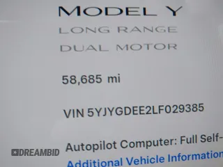 2020 Tesla Model Y Long Range with VIN 5YJYGDEE2LF029385, listed as a IAAI auction lot 42164786 with 58,685 mi miles and . Bid and sale history available at DreamBid. Image 7.