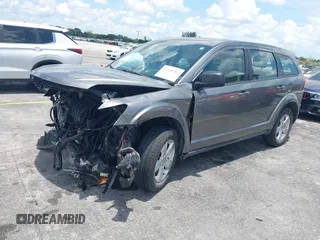 2013 Dodge Journey SE with VIN 3C4PDCAB3DT626929, listed as a IAAI auction lot 42318702 with Not provided miles and . Bid and sale history available at DreamBid. Image 2.