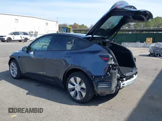 2023 Tesla Model Y Long Range with VIN 7SAYGDEE7PF856985, listed as a IAAI auction lot 42097675 with 13,112 mi miles and . Bid and sale history available at DreamBid. Image 3.