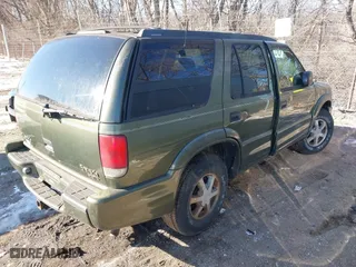2001 Oldsmobile Bravada with VIN 1GHDT13W312184767, listed as a IAAI auction lot 41347993 with 130,306 mi miles. Bid and sale history available at carsss.com. Image 4.