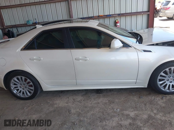 2013 Cadillac CTS Premium z VIN 1G6DS5E30D0105240, wystawiony jako IAAI lot #42145007 z przebiegiem 100 893 mil mil oraz . Historia ofert i sprzedaży dostępna na DreamBid. Obrazek 13.
