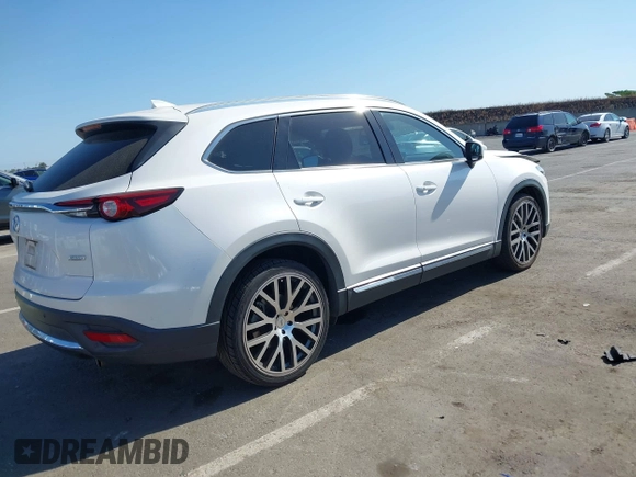 2017 Mazda CX-9 Grand Touring with VIN JM3TCBDY3H0132351, listed as a IAAI auction lot 42346910 with 124,990 mi miles and . Bid and sale history available at DreamBid. Image 4.