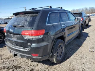 2014 Jeep Grand Cherokee Overland with VIN 1C4RJFCT8EC409673, listed as a Copart auction lot 45271555 with 136,810 mi miles and Salvage Title. Bid and sale history available at carsss.com. Image 3.