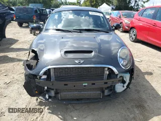 2015 MINI Coupe S z VIN WMWSX3C55FT409449, wystawiony jako Copart lot #66574174 z przebiegiem 99 155 mil mil oraz Szkody całkowita. Historia ofert i sprzedaży dostępna na DreamBid. Obrazek 5.