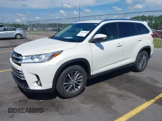 2019 Toyota Highlander SE with VIN 5TDKZRFH7KS551929, listed as a IAAI auction lot 42627458 with 84,117 mi miles and . Bid and sale history available at DreamBid. Image 2.