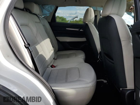 2018 Mazda CX-5 Grand Touring z VIN JM3KFBDM6J0447165, wystawiony jako Copart lot #56133015 z przebiegiem 80 579 mil mil oraz Szkoda całkowita • Salvage title. Historia ofert i sprzedaży dostępna na DreamBid. Obrazek 11.