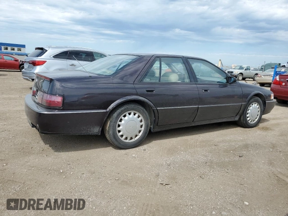1992 Cadillac Seville z VIN 1G6KY53BXNU804126, wystawiony jako Copart lot #69219394 z przebiegiem 100 647 mil mil oraz Czysty tytuł • Clean title. Historia ofert i sprzedaży dostępna na DreamBid. Obrazek 3.