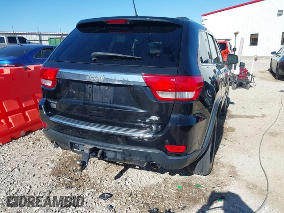 2013 Jeep Grand Cherokee Overland with VIN 1C4RJFCT1DC654653, listed as a IAAI auction lot 41826619 with 124,283 mi miles. Bid and sale history available at carsss.com. Image 4.
