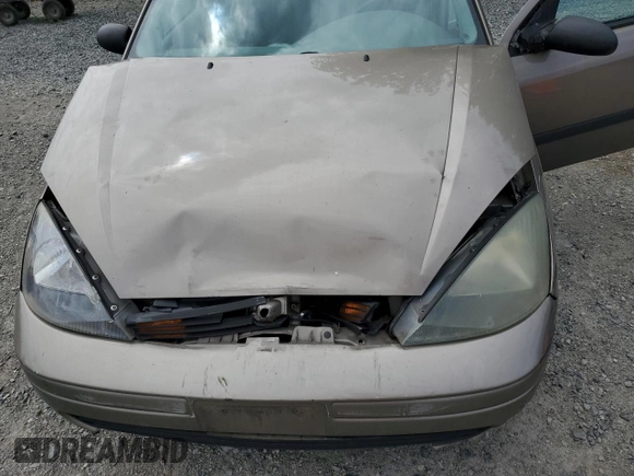 2004 Ford Focus LX with VIN 1FAFP33P24W148563, listed as a Copart auction lot 63869755 with 142,243 mi miles and Salvage title. Bid and sale history available at DreamBid. Image 11.
