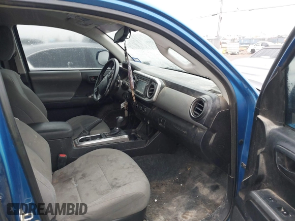 2016 Toyota Tacoma SR with VIN 5TFCZ5AN4GX013233, listed as a IAAI auction lot 41394610 with 142,099 mi miles and . Bid and sale history available at DreamBid. Image 5.