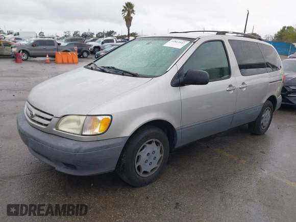 2002 Toyota Sienna CE with VIN 4T3ZF19C02U493816, listed as a IAAI auction lot 41813141 with 216,915 mi miles. Bid and sale history available at carsss.com. Image 2.