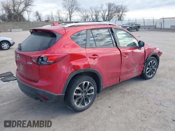 2016 Mazda CX-5 Grand Touring with VIN JM3KE4DY8G0729446, listed as a IAAI auction lot 41871207 with 89,258 mi miles. Bid and sale history available at carsss.com. Image 4.