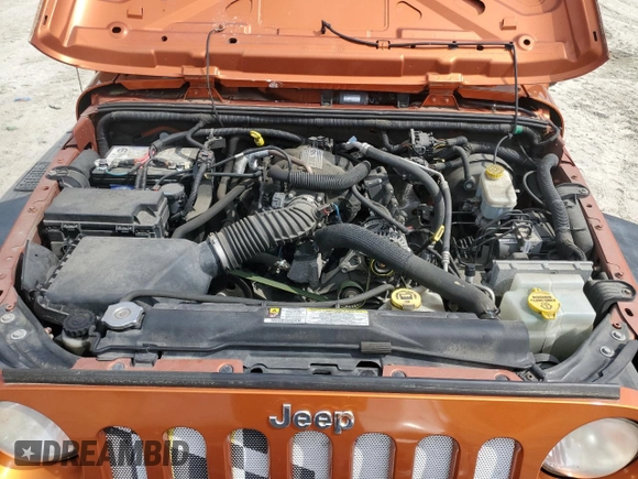 2011 Jeep Wrangler Sport with VIN 1J4AA2D15BL574234, listed as a Copart auction lot 52952605 with 114,642 mi miles and Salvage Title. Bid and sale history available at carsss.com. Image 11.
