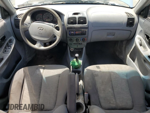 2004 Hyundai Accent GL z VIN KMHCG45C94U574027, wystawiony jako Copart lot #57463905 z przebiegiem 139 595 mil mil oraz Szkoda całkowita • Salvage title. Historia ofert i sprzedaży dostępna na DreamBid. Obrazek 8.