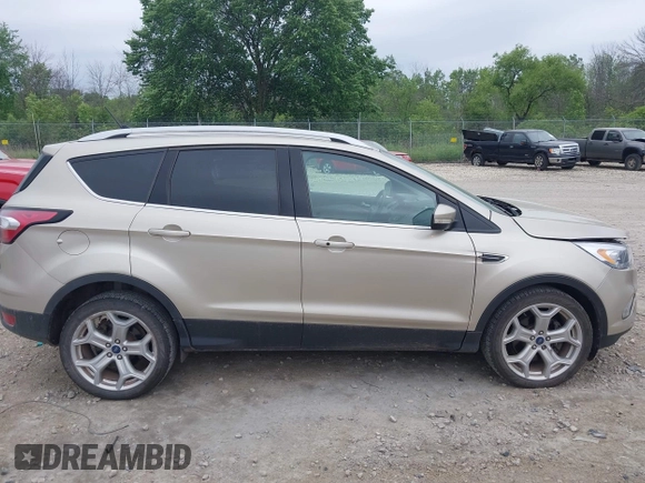 2018 Ford Escape Titanium with VIN 1FMCU9J94JUA44964, listed as a IAAI auction lot 42494471 with 100,955 mi miles and . Bid and sale history available at DreamBid. Image 13.