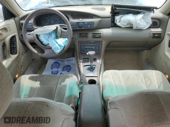 2000 Mazda Millenia with VIN JM1TA2210Y1614967, listed as a Copart auction lot 53606185 with 120,288 mi miles and Salvage Title. Bid and sale history available at DreamBid. Image 8.