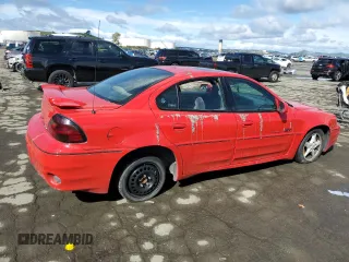 1999 Pontiac Grand Am GT1 with VIN 1G2NW52E5XM768638, listed as a Copart auction lot 49077115 with 113,018 mi miles and Salvage Title. Bid and sale history available at carsss.com. Image 3.