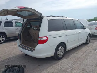 2007 Honda Odyssey EX-L with VIN 5FNRL38787B051582, listed as a IAAI auction lot 42104718 with 193,630 mi miles and . Bid and sale history available at DreamBid. Image 4.
