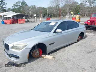 2011 BMW 7 Series 740i with VIN WBAKA4C59BC392365, listed as a IAAI auction lot 41618732 with 142,270 mi miles. Bid and sale history available at carsss.com. Image 2.