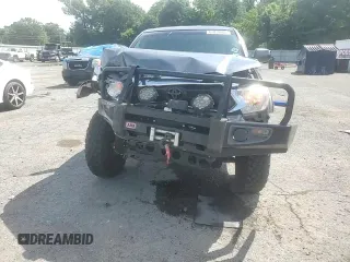 2014 Toyota Tacoma with VIN 3TMLU4EN2EM163797, listed as a Copart auction lot 61078805 with 130,748 mi miles and Salvage title. Bid and sale history available at DreamBid. Image 14.