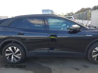2023 Volkswagen ID.4 Pro z VIN 1V2DNPE85PC028748, wystawiony jako IAAI lot #41348983 z przebiegiem 7 434 mil mil oraz . Historia ofert i sprzedaży dostępna na DreamBid. Obrazek 13.